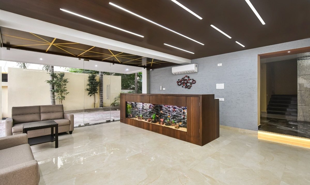 Custom living room feature aquarium designed for a modern home in Chennai